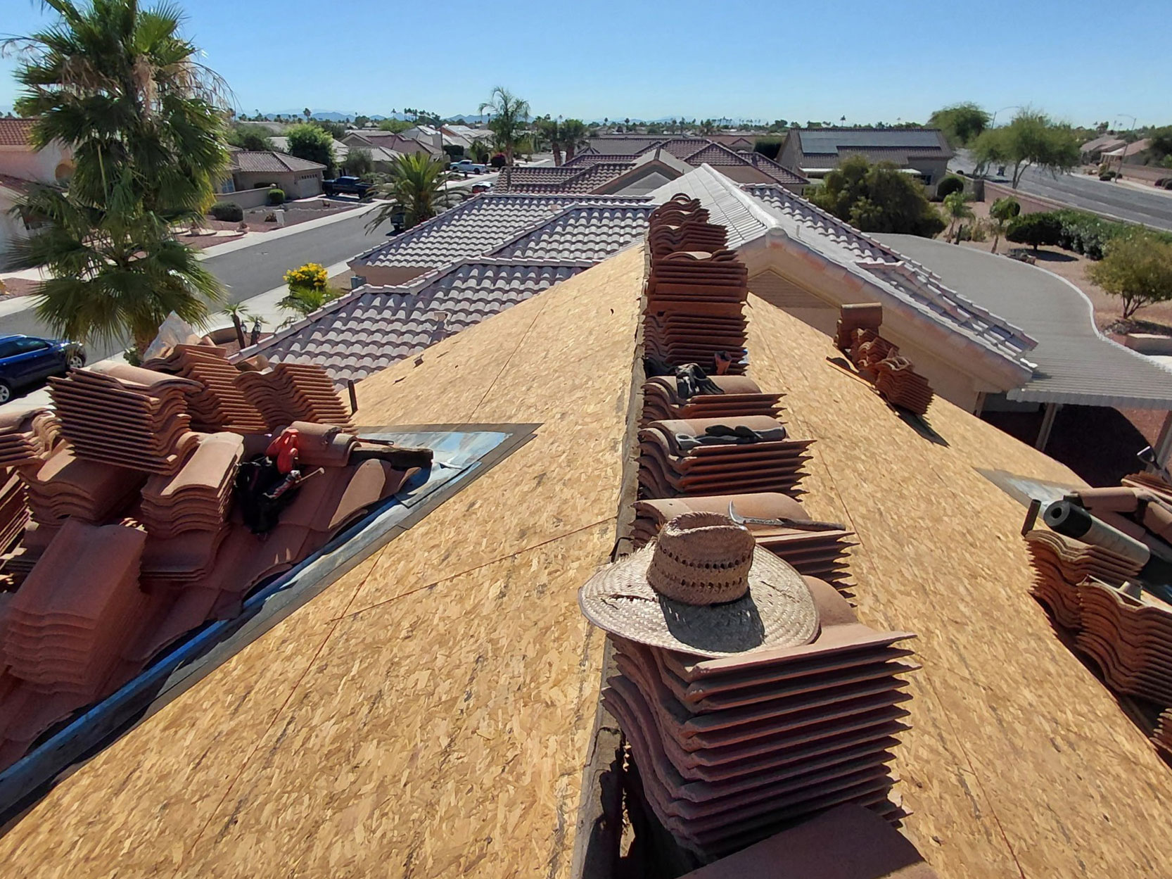 OSB roof decking exposed during tile roof underlayment replacement project in Sun City West AZ
