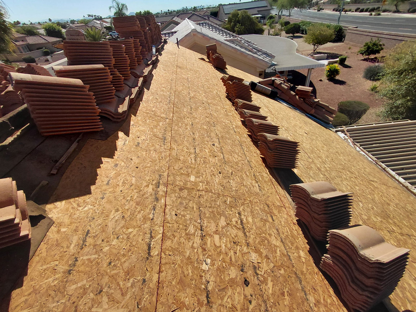 Roof deck prepared for new underlayment installation during Sun City West tile roofing project