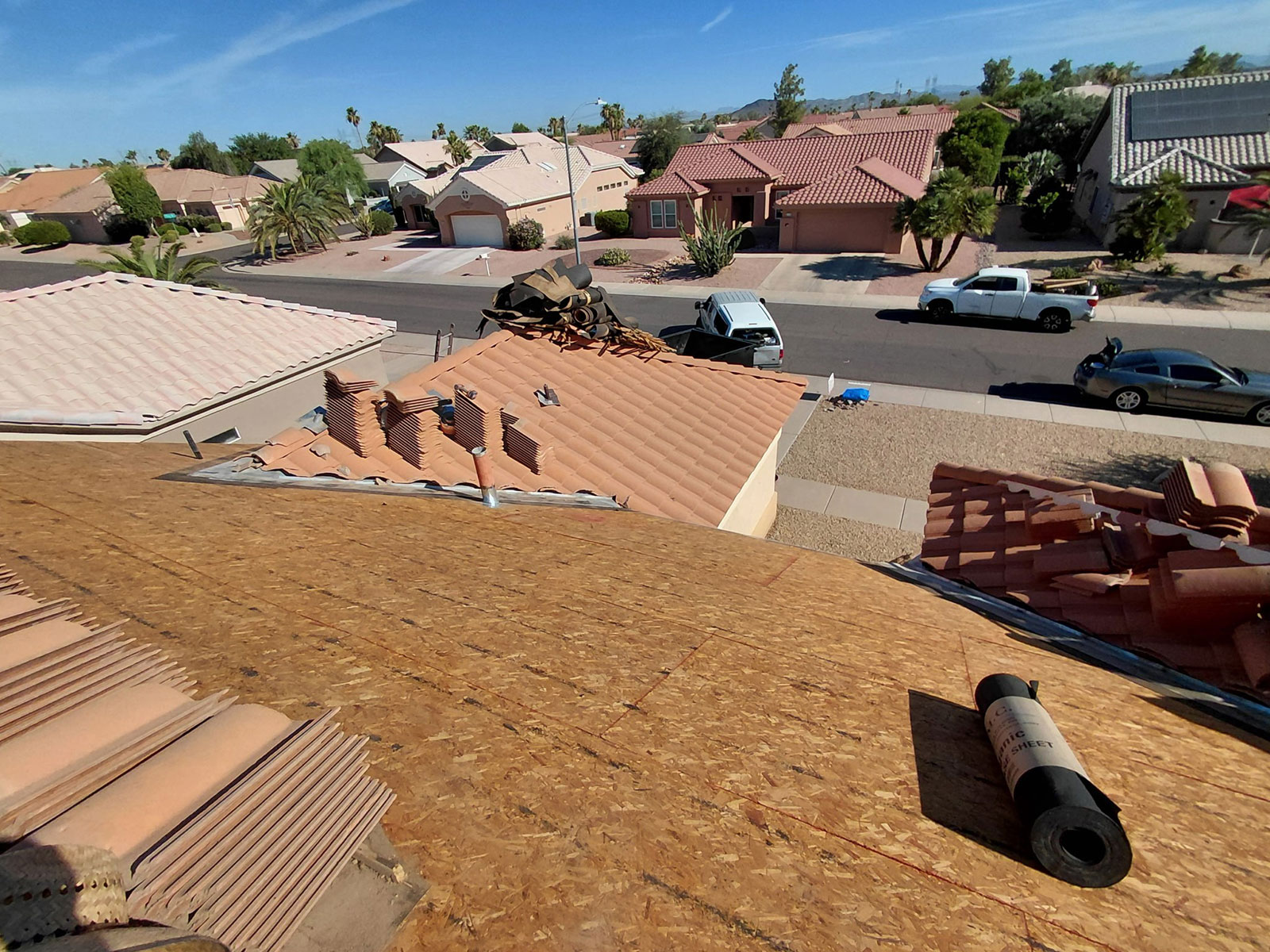 Tile roof underlayment replacement project with exposed roof decking in Sun City West AZ