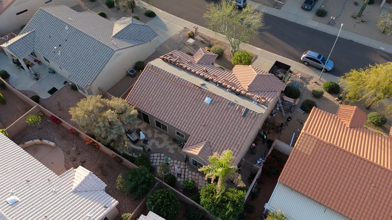 Tile roof ridge and hip area showing preparation for weather protection and finishing in Arizona