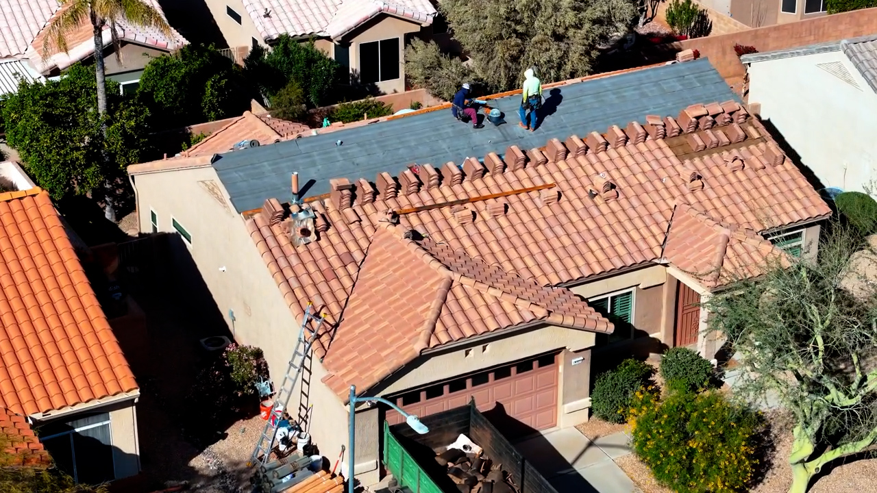 Tile roof battens and flashing installation in Arizona showing wood battens and roof ventilation setup